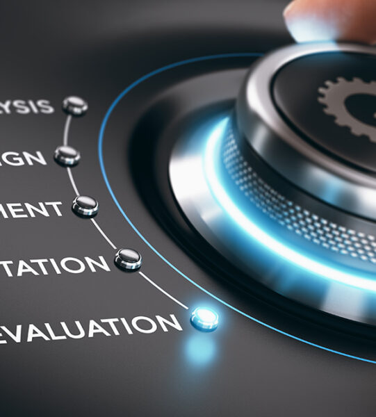 Hand turning button to the evaluation phase. Composite image between a hand photography